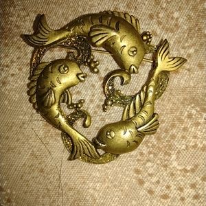 This is a beautiful brooch .not sure of maker but it's a wonderful accent piece.